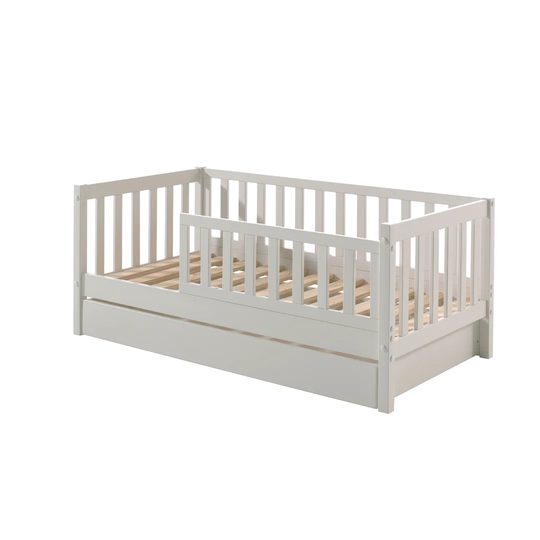 Junior bed with bed surface 70 x 140cm, border with vertical bars, includes bed drawer, finish. Solid pine light gray lacquer
